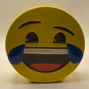Ceramic laughing emoji bank, 2015.